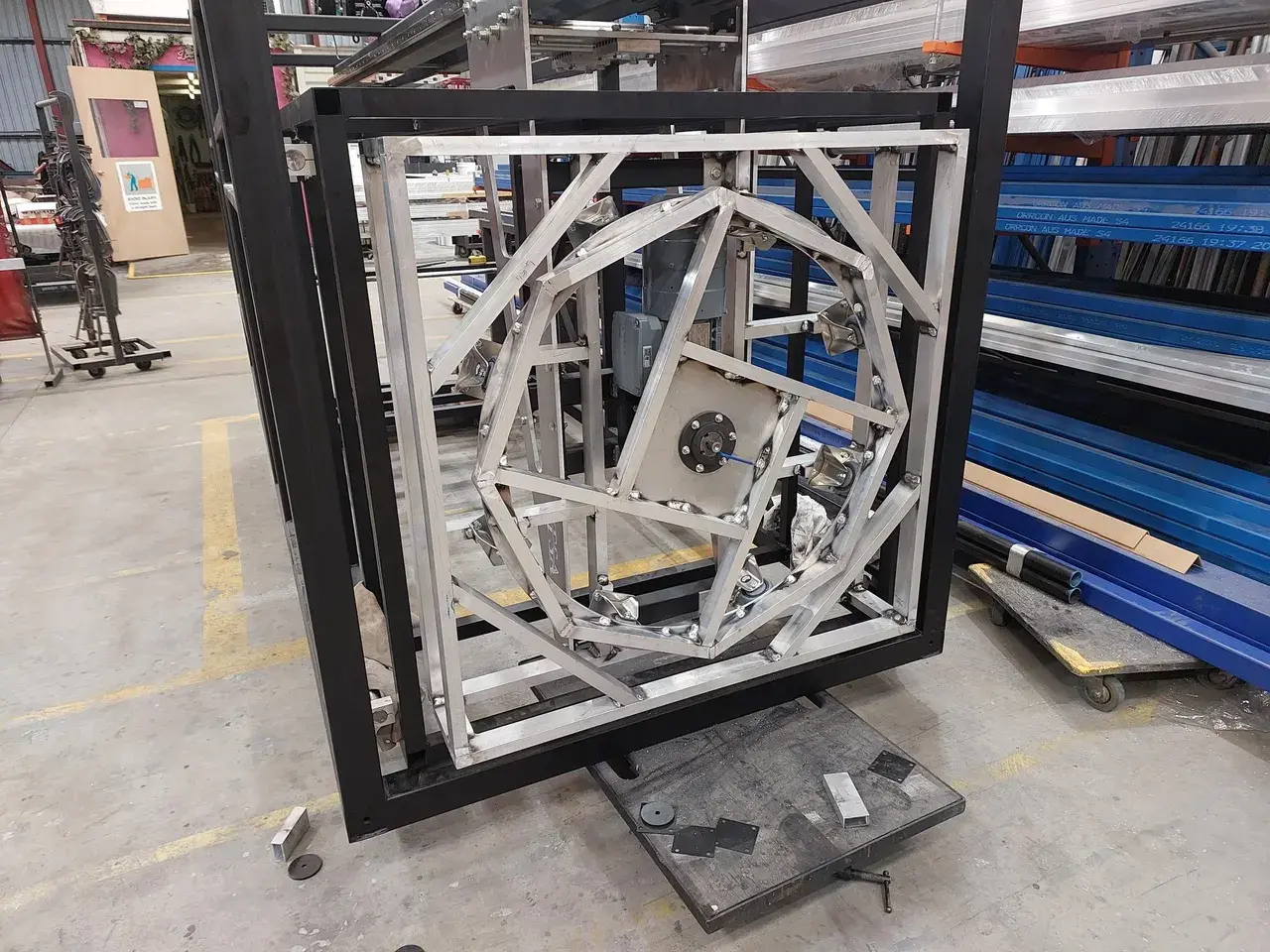 The custom toaster lift mechanism under build in the TSA workshop, servo drive mounted in its steel frame